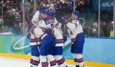 Feb 20, 2026; Milan, Italy; The United States celebrates a goal scored by Jack Eichel during the second period against Slovakia in a men's ice hockey semifinal during the Milano Cortina 2026 Olympic Winter Games at Milano Santagiulia Ice Hockey Arena. Mandatory Credit: James Lang-Imagn Images