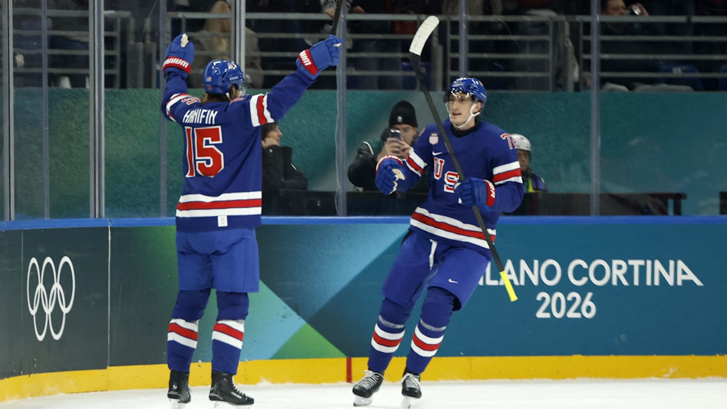 Feb 14, 2026; Milan, Italy;  Noah Hanifin of United States celebrates scoring their fourth goal with Tage Thompson of United States against Denmark in men's ice hockey group C play during the Milano Cortina 2026 Olympic Winter Games at Milano Santagiulia Ice Hockey Arena. Mandatory Credit: Geoff Burke-Imagn Images