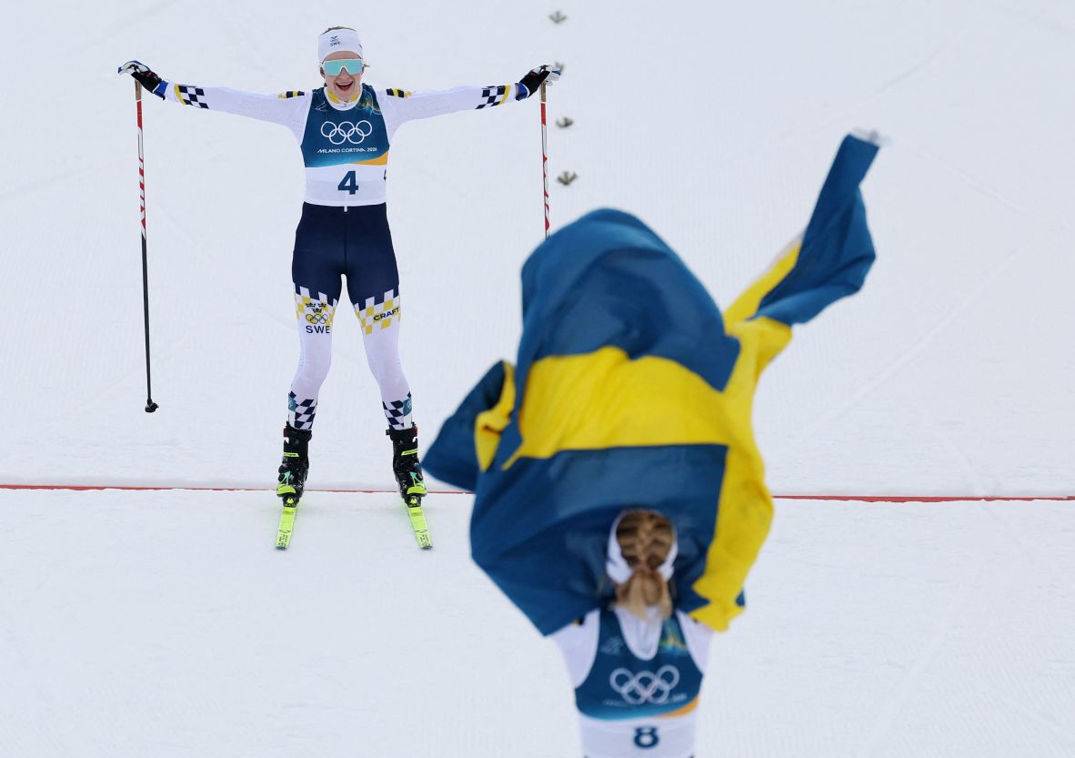 Sweden's Ebba Andersson, left, and Frida Karlsson celebrate after winning silver and gold, respectively, in <a href=
