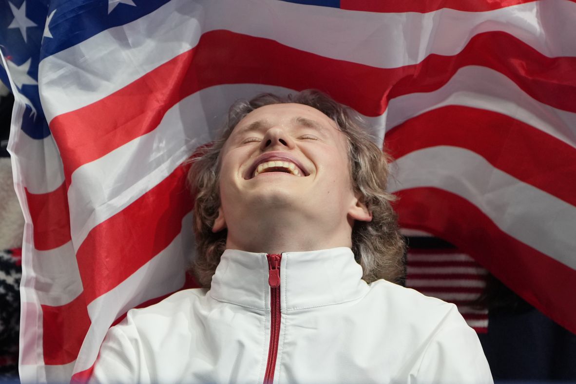 Malinin reacts to his scores after competing on February 7.