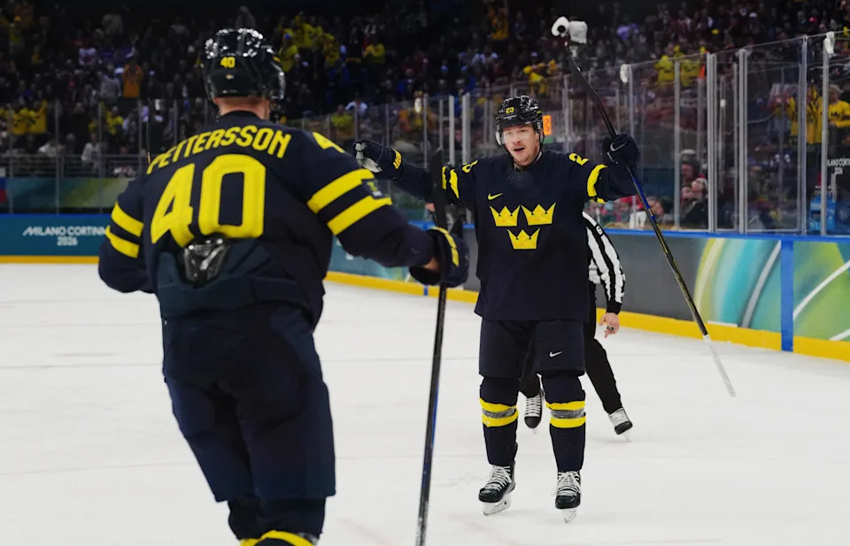 <p>Feb 14, 2026; Milan, Italy; Elias Pettersson of Sweden celebrates scoring their fourth goal with Lucas Raymond of Sweden during a Group B men’s ice hockey game during the Milano Cortina 2026 Olympic Winter Games at Milano Santagiulia Ice Hockey Arena. Mandatory Credit: James Lang-Imagn Images</p>