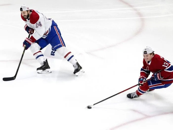  Montreal Canadiens centre Phillip Danault (24) and right wing Cole Caufield (13) share a laugh on the obstacle course during the team’s skills competition at the Bell Centre on Sunday, February 22, 2026. Danault went on to beat Caufield on the course.