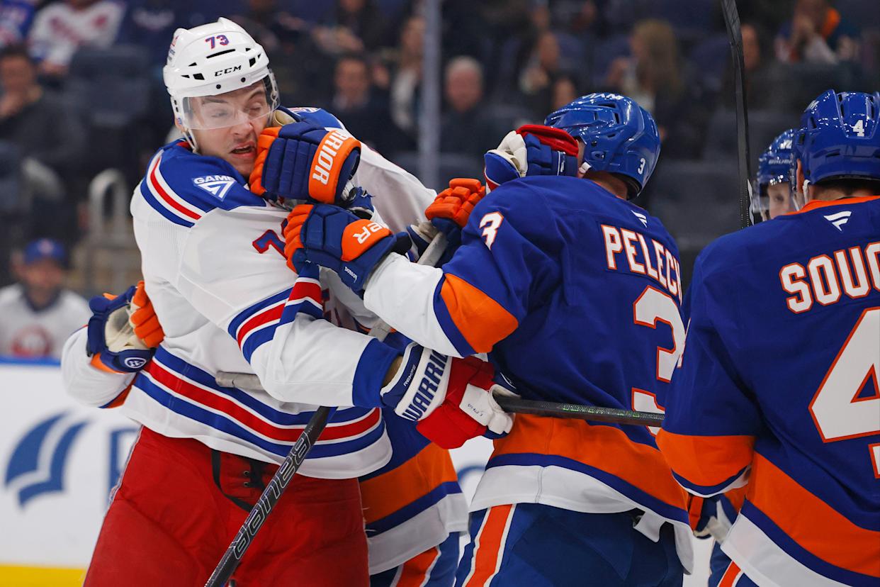 New York Rangers center Matt Rempe (73) and New York Islanders defenseman Adam Pelech (3) fight during the second period when the New York Islanders played the New York Rangers Wednesday, January 28, 2026 at UBS Arena in Elmont, NY.