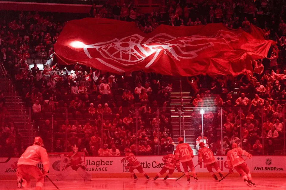 Detroit Red Wings fans move a big Red Wings banner across before puck drop against Tampa Bay Lightning at Little Caesars Arena in Detroit on Saturday, Feb. 8, 2025.