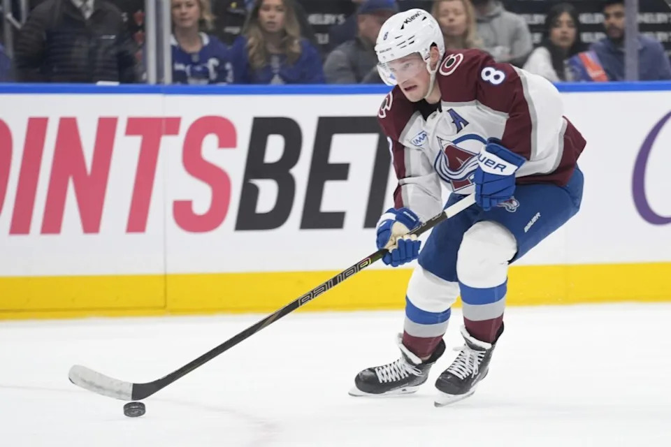 Jan 25, 2026; Toronto, Ontario, CAN; Colorado Avalanche defenseman Cale Makar (8) carries the puck against the Toronto Maple Leafs during the second period at Scotiabank Arena. Mandatory Credit: John E. Sokolowski-Imagn Images