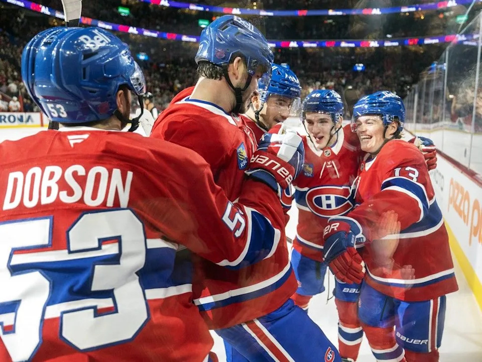  Canadiens defenceman Noah Dobson celebrates a first-period goal against the New York Islanders with Kirby Dach, Nick Suzuki, Lane Hutson and Cole Caufield in Montreal on Thursday night.