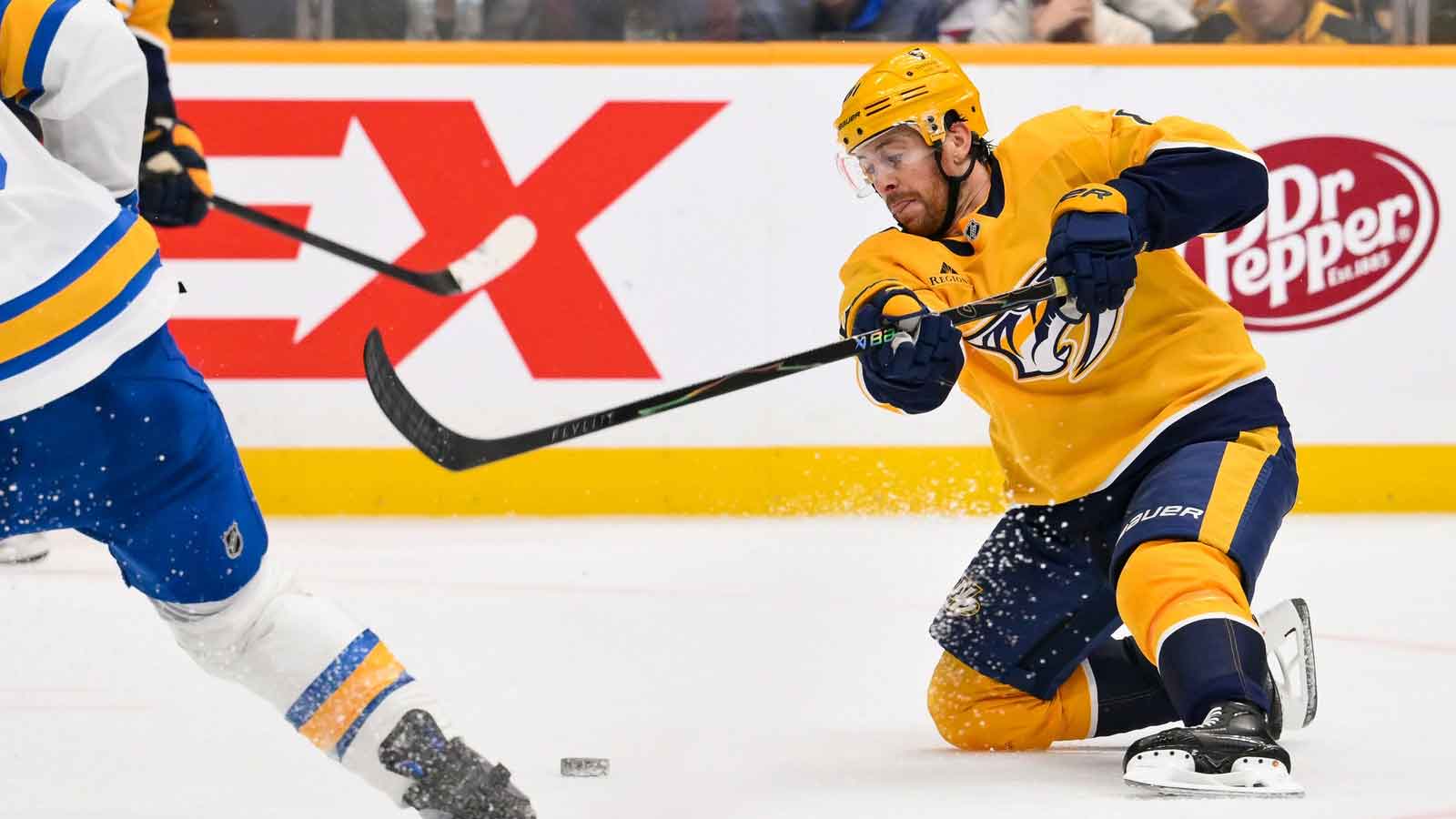 Nashville Predators left wing Michael Bunting (58) takes a shot on goal against the St. Louis Blues during the second period at Bridgestone Arena.