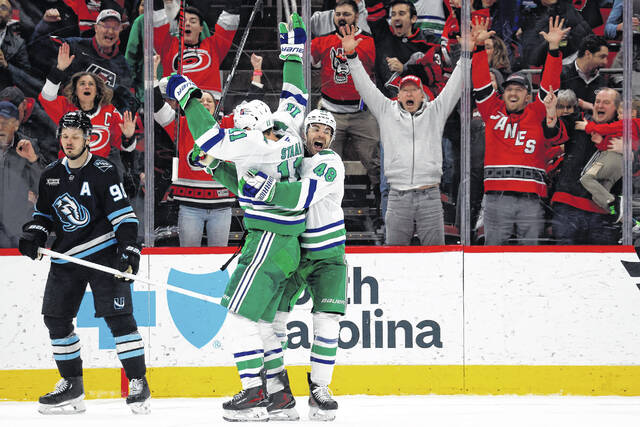 Hurricanes become 3rd NHL team to rally from 2 goals down in final 2 minutes to win in regulation