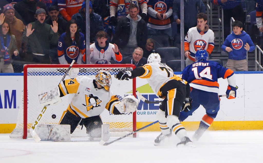 Bo Horvat #14 of the New York Islanders scores the game-winning goal in overtime when the New York Islanders played the Pittsburgh Penguins Tuesday, February 3, 2026 at UBS Arena in Elmont, NY.