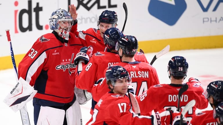 Washington Capitals goaltender Clay Stevenson (33) celebrates with teammates after...