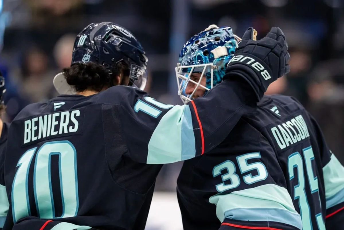 Jan 29, 2026; Seattle, Washington, USA; Seattle Kraken goalie Joey Daccord (35) and forward Matty Beniers (10) celebrate after a game against the Toronto Maple Leafs at Climate Pledge Arena. Mandatory Credit: Stephen Brashear-Imagn Images
