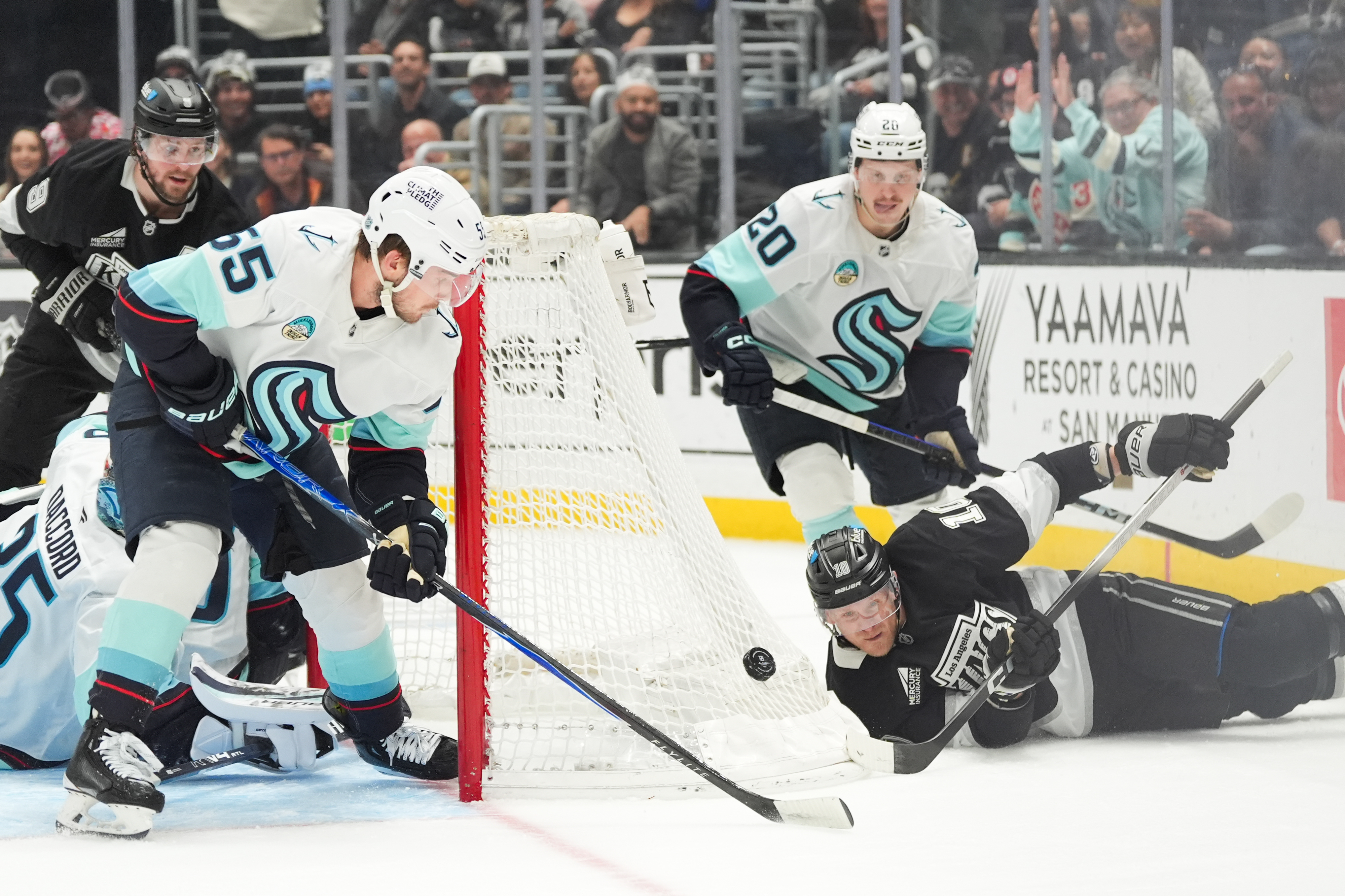 Kings right wing Corey Perry (10) falls to the ice...