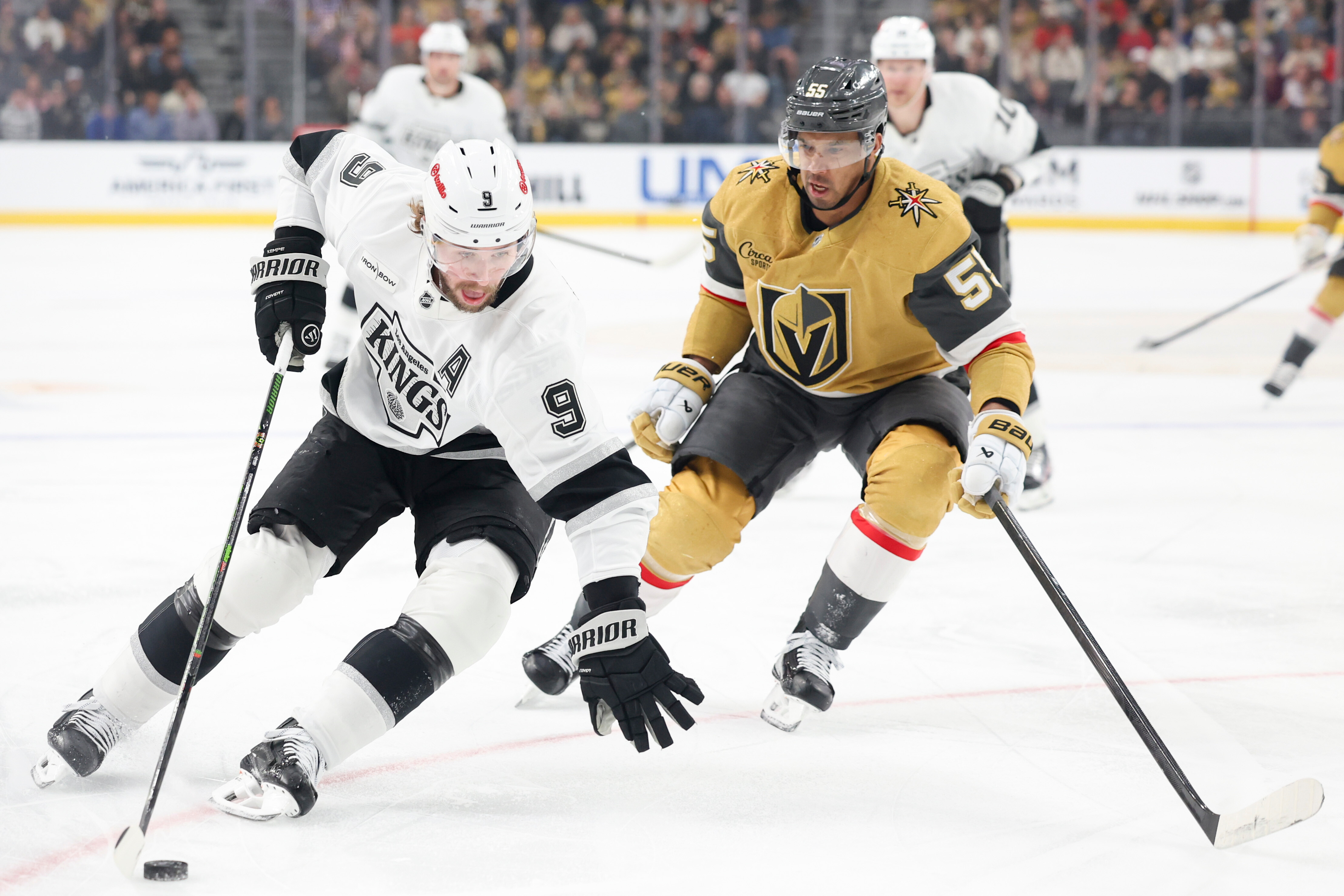Kings right wing Adrian Kempe, left, skates against Vegas Golden...