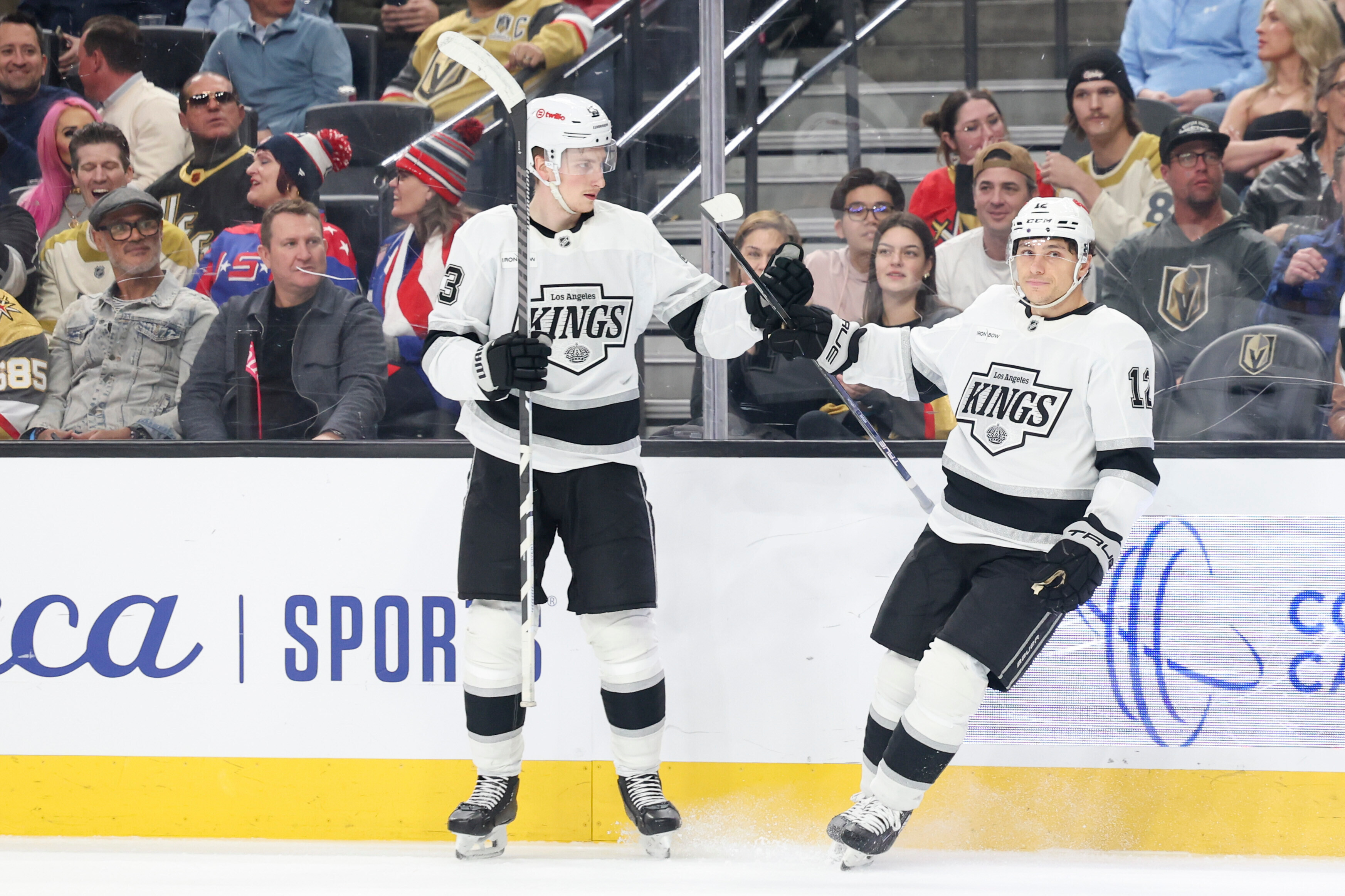 Kings defenseman Jacob Moverare, left, and left wing Trevor Moore...