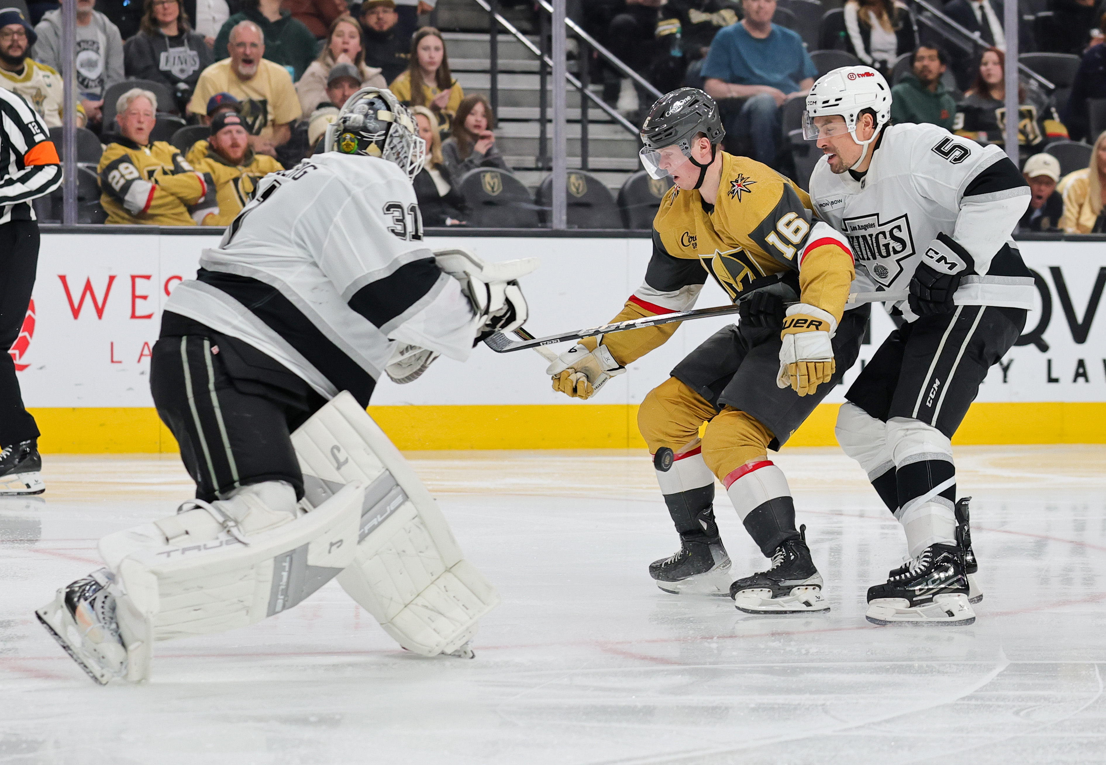 Kings goaltender Anton Forsberg, left, comes out of the crease...