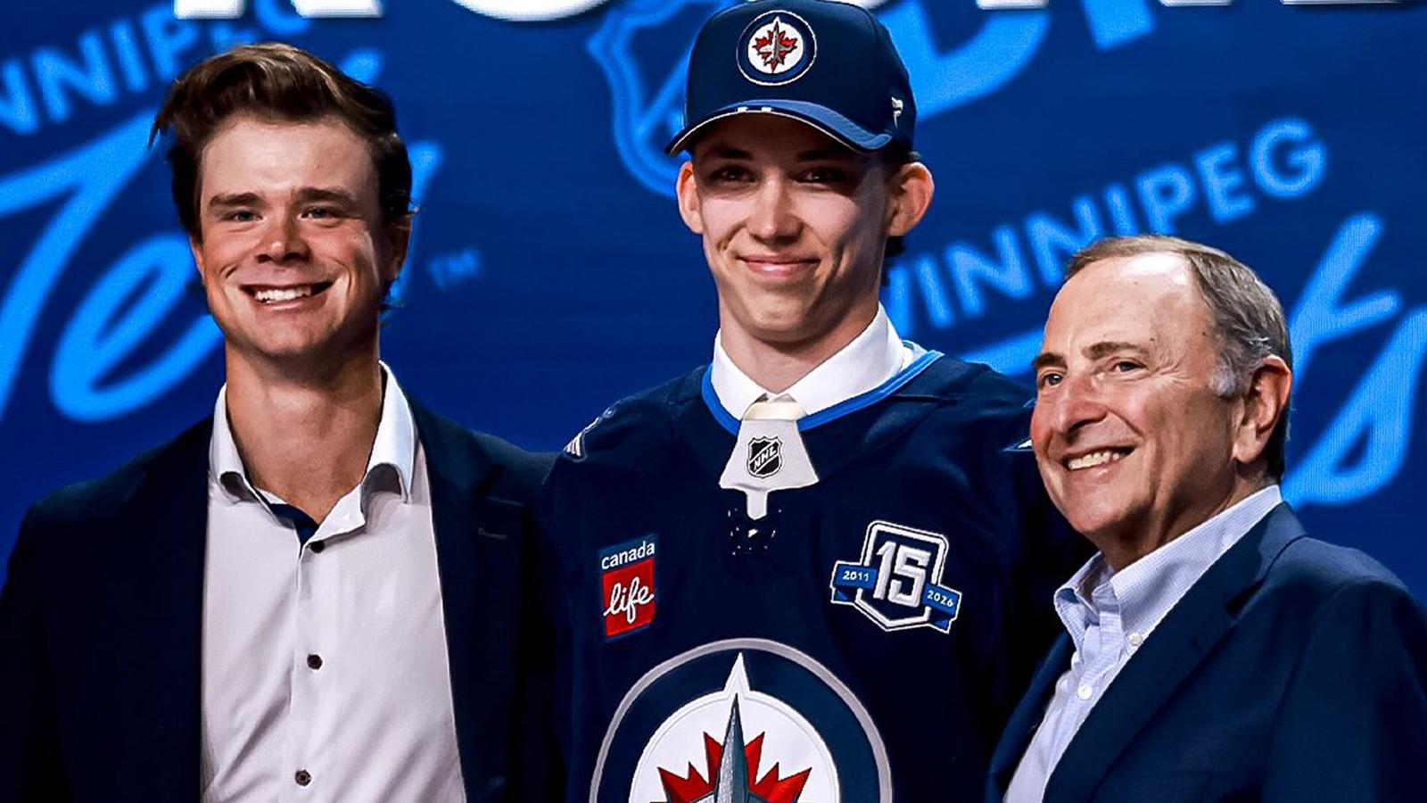 Men's ice hockey players standing on the blue line during the national anthem at the Beanpot