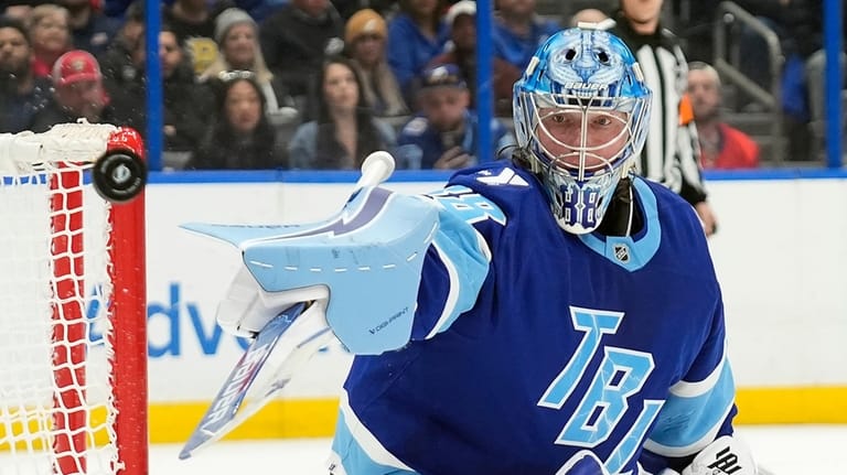 Tampa Bay Lightning goaltender Andrei Vasilevskiy (88) makes a blocker...