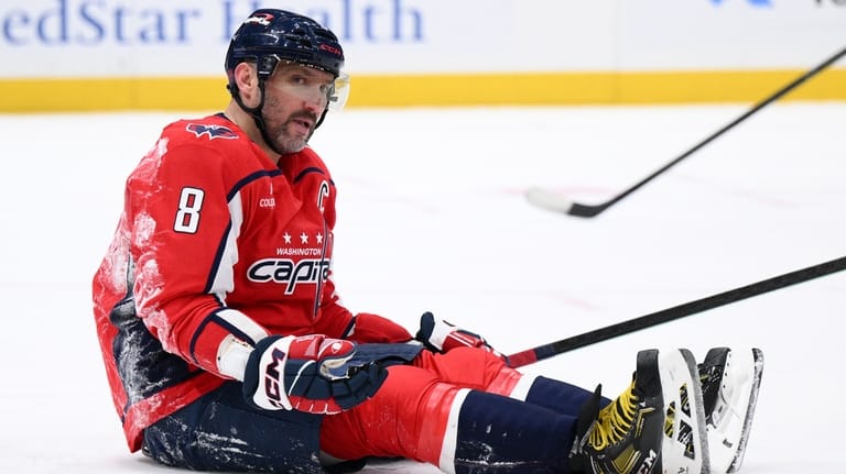 Washington Capitals left wing Alex Ovechkin (8) sits on the...