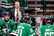 Dallas Stars head coach Glen Gulutzan delivers instruction to his players during a Carolina...