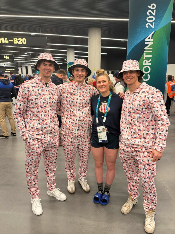In this photo provided by Janet Winn, Casey Winn, left, poses with his siblings Tommy, U.S. hockey defender Haley, and Ryan Winn on Feb. 9, 2026, in Milan, Italy. (Janet Winn via AP)