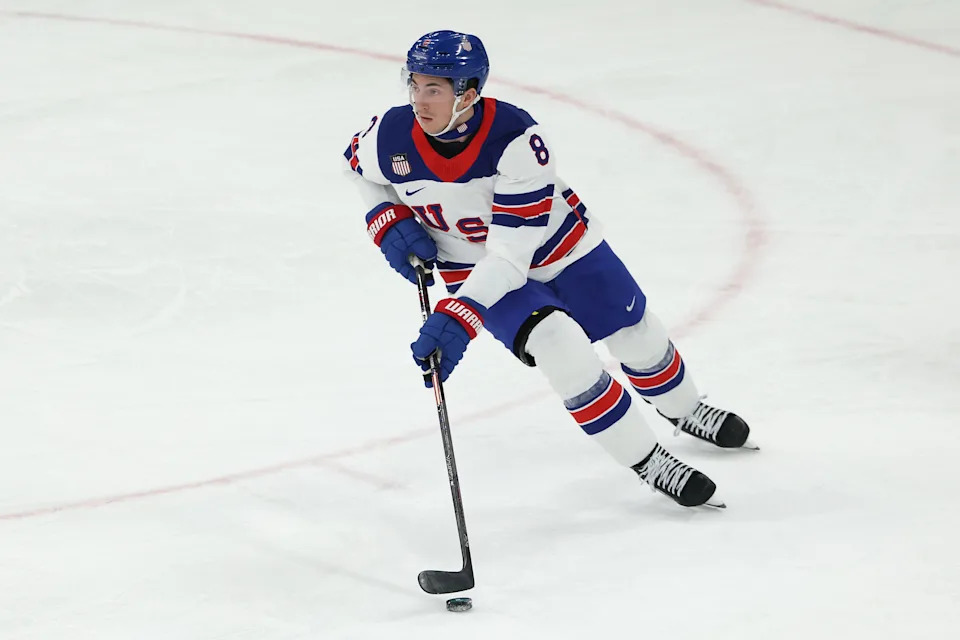 MILAN, ITALY - FEBRUARY 20: Zach Werenski #8 of Team United States skates with the puck in the first period during the Men's Semifinals Playoff match between the United States and Slovakia on day fourteen of the Milano Cortina 2026 Winter Olympic games at Milano Santagiulia Ice Hockey Arena on February 20, 2026 in Milan, Italy. (Photo by Jamie Squire/Getty Images)