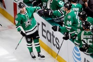 Dallas Stars center Mavrik Bourque (22) is congratulated by teammates on the bench following...