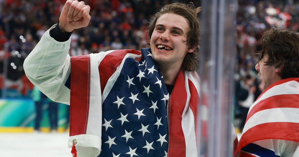 Photographer describes capturing hockey star Jack Hughes' toothless grin after gold-medal win: "Still in shock"