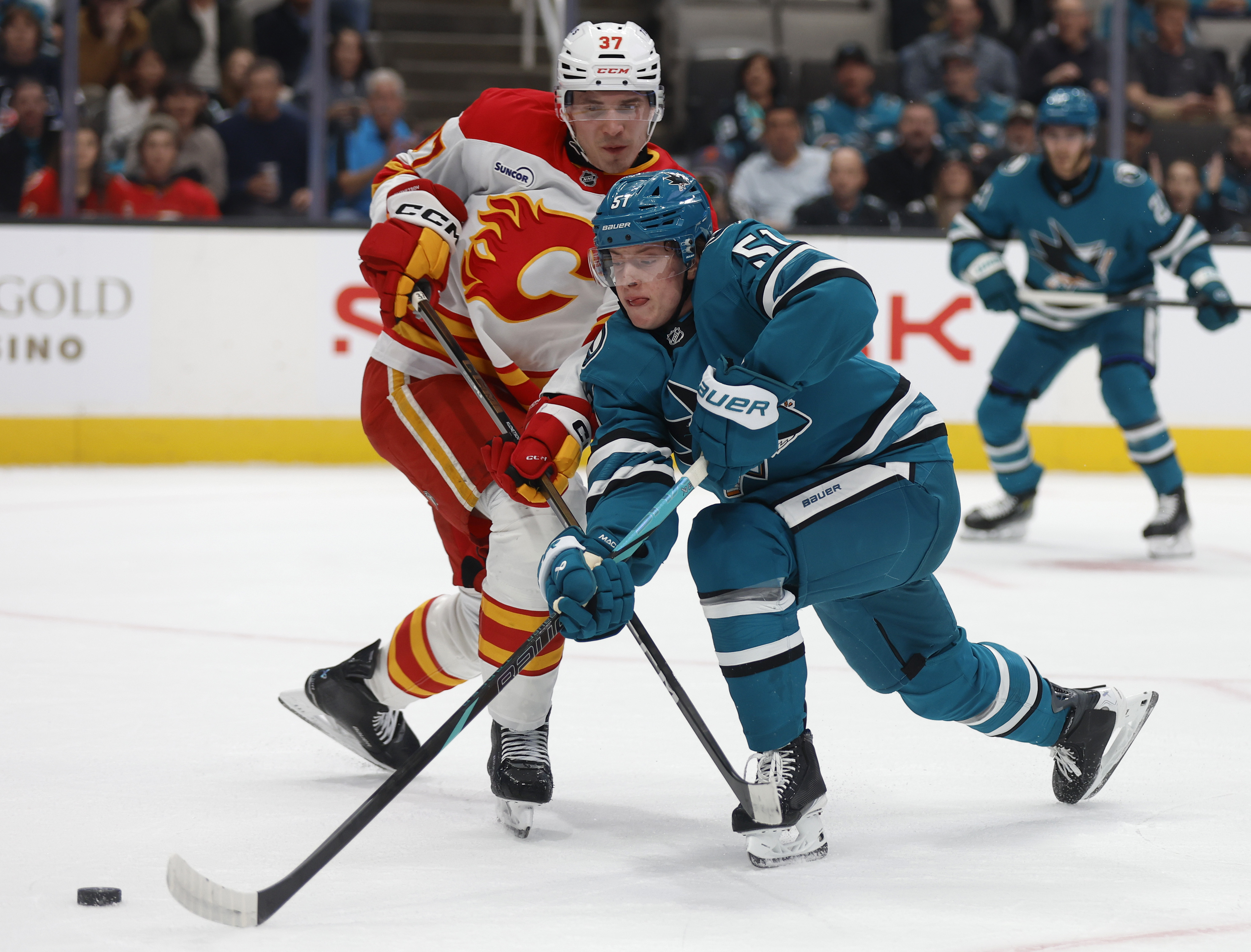 San Jose Sharks’ Collin Graf (51) fights for the puck...
