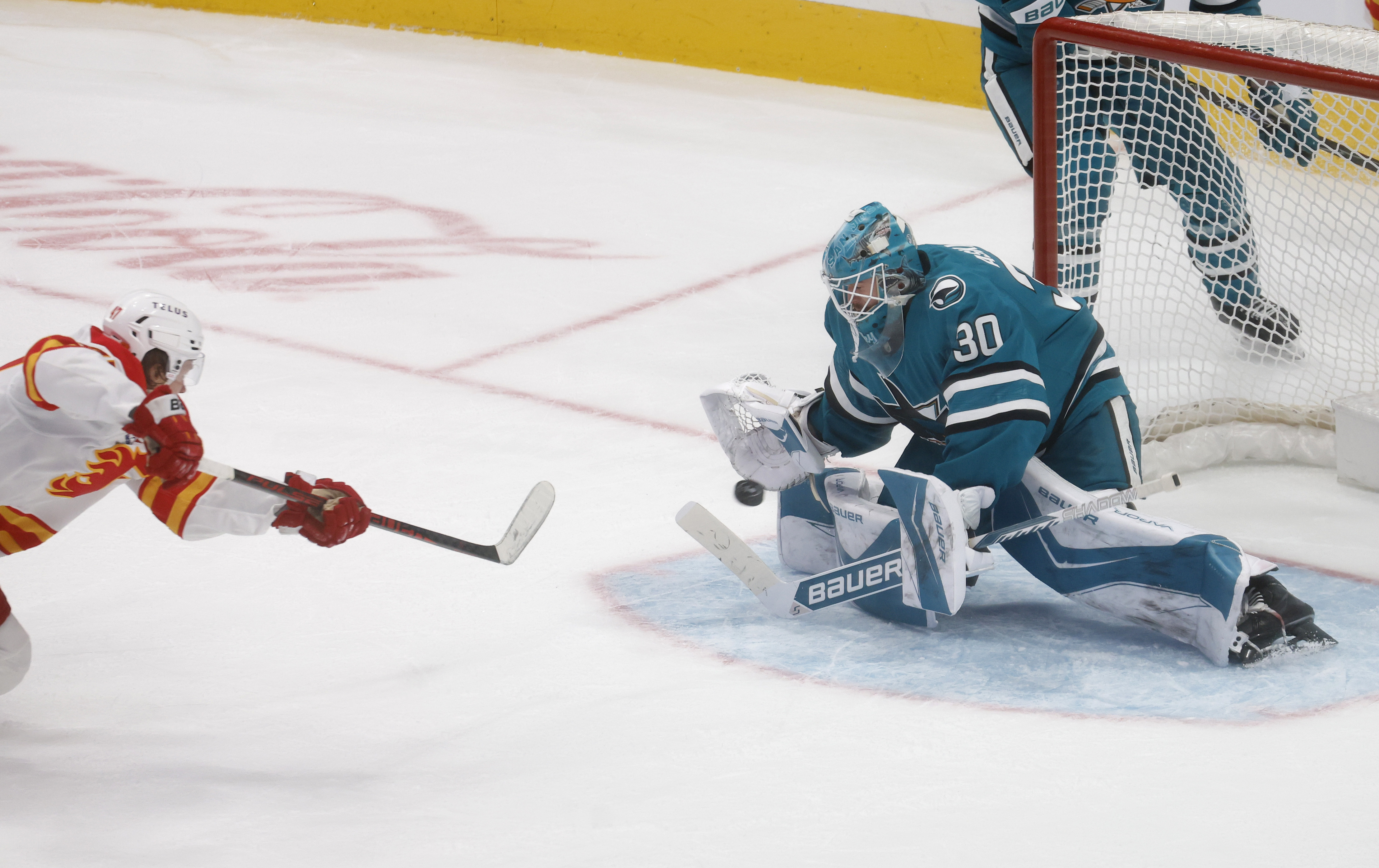 San Jose Sharks goaltender Yaroslav Askarov (30) blocks a shot...