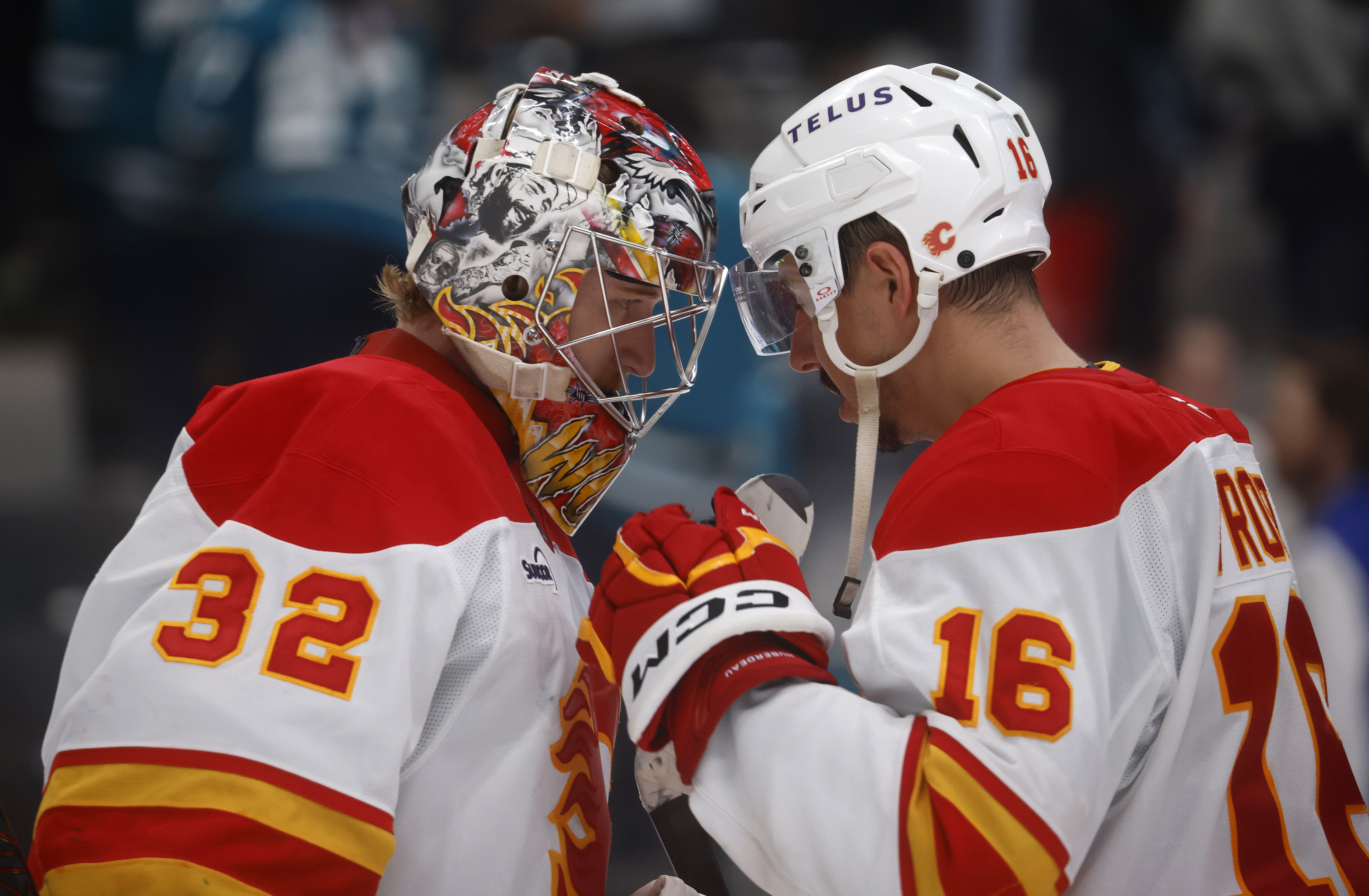 Calgary Flames goaltender Dustin Wolf (32) is congratulated by Calgary...
