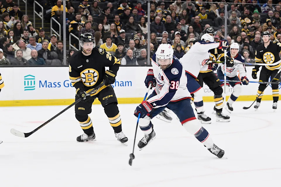Feb 26, 2026; Boston, Massachusetts, USA; Columbus Blue Jackets center Boone Jenner (38) shoots the puck against the Boston Bruins during the second period at TD Garden. Mandatory Credit: Eric Canha-Imagn Images