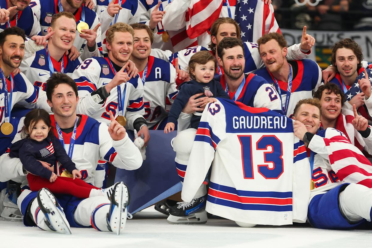 Gregory Shamus/Getty Images - PHOTO: USA ice hockey players hold the children of former player Johnny Gaudreau who was killed in an accident in 2024, after they won the gold medal at the Milano Cortina 2026 Winter Olympic Games, February 22, 2026 in Milan, Italy.