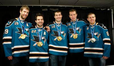 San Jose Sharks center Joe Thornton (19), defenseman Dan Boyle (22), center Patrick Marleau (12), left wing Dany Heatley (15) and center Joe Pavelski (8) show their Vancouver Olympic medals during a news conference in San Jose, Calif., Tuesday, March 2, 2010. Thornton, Boyle, Marleau and Heatley won gold playing for Canada. Pavelski won silver playing the U.S. (AP Photo/Paul Sakuma)