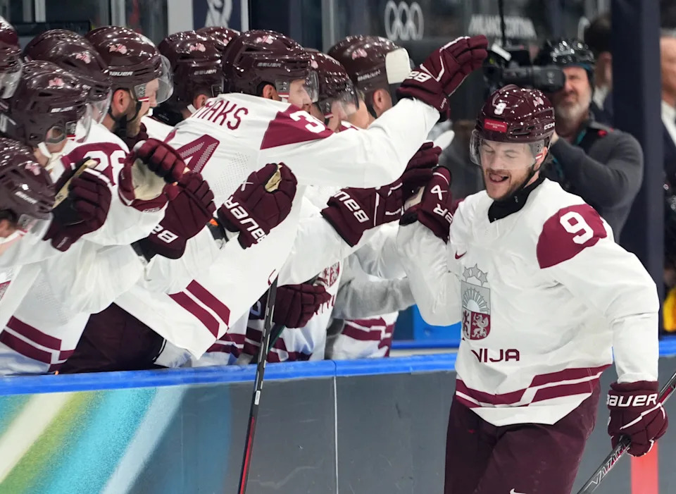 <p>Feb 14, 2026; Milan, Italy; Renars Krastenbergs of Latvia celebrates with teammates after scoring their fourth goal during a Group C men’s ice hockey game during the Milano Cortina 2026 Olympic Winter Games at Milano Rho Ice Hockey Arena. Mandatory Credit: Amber Searls-Imagn Images</p>