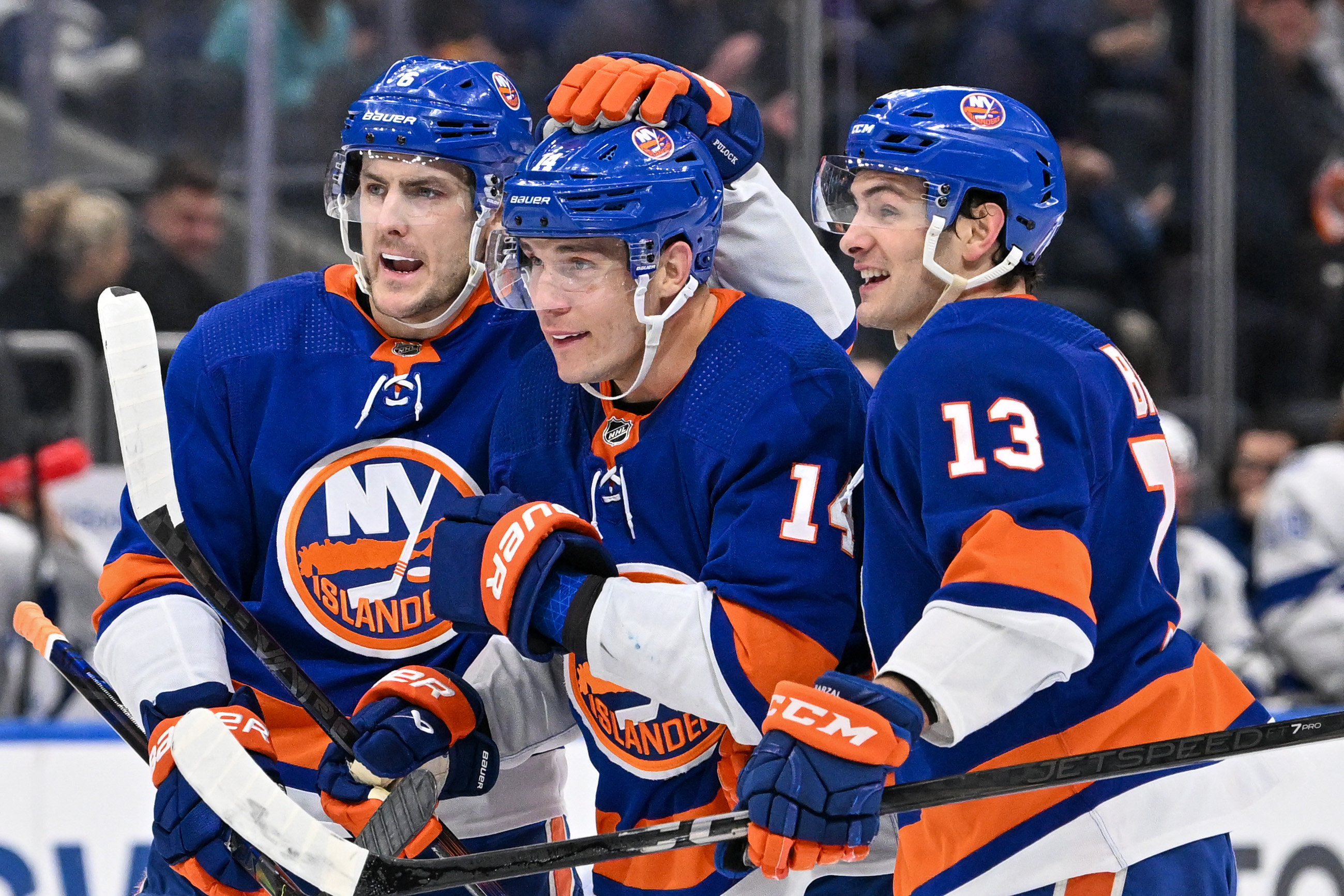 Mathew Barzal Bo Horvat Ryan pulock of the Islanders celebrate a goal