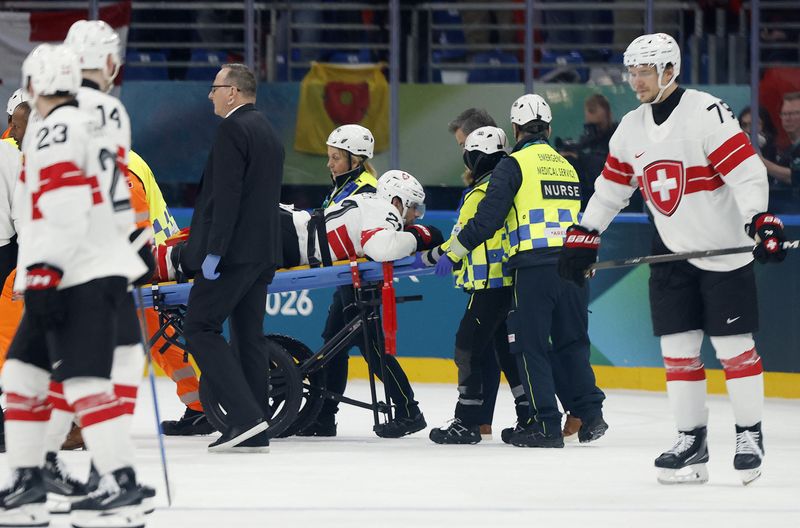 Swiss F Kevin Fiala (leg) stretchered off vs. Canada | WKZO | Everything Kalamazoo