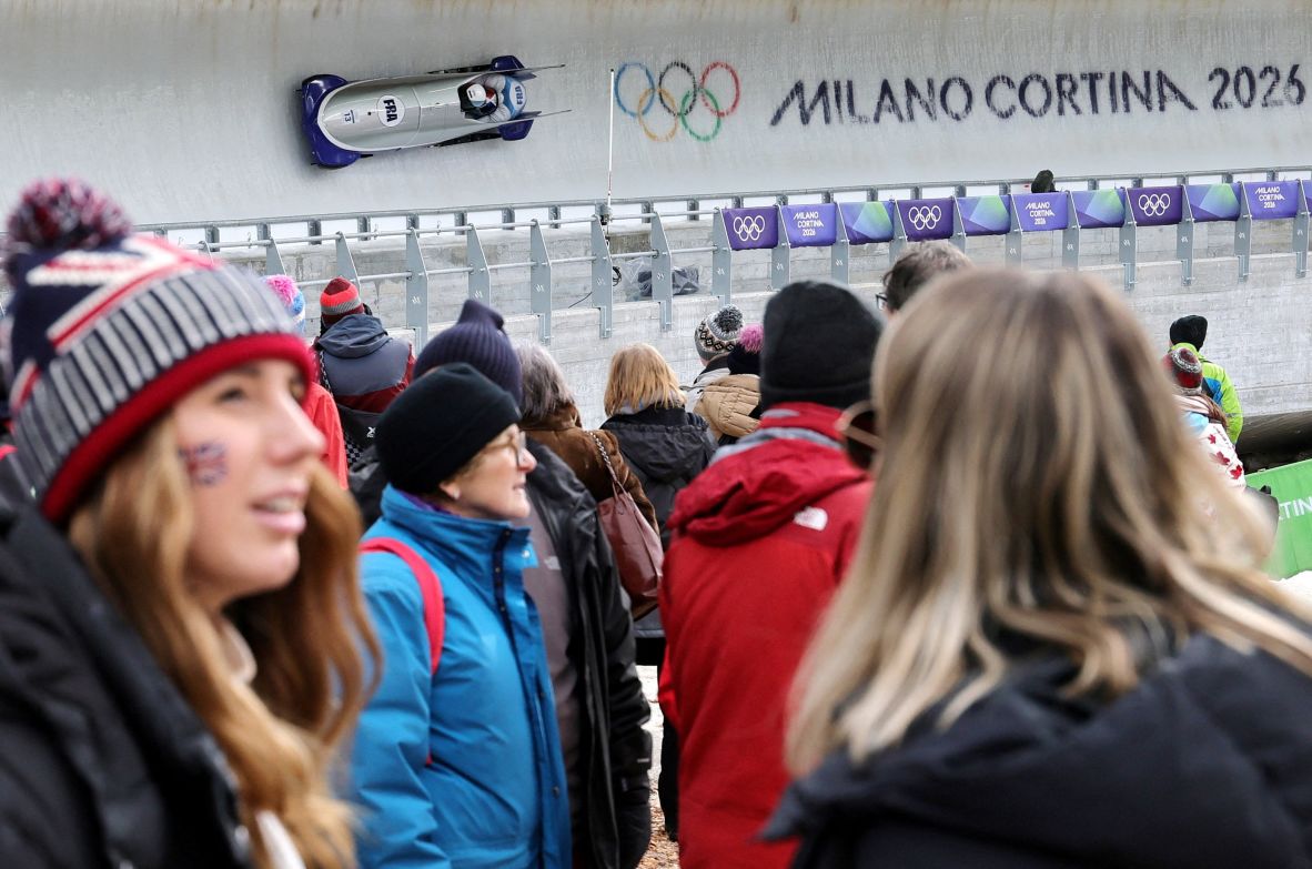 A crowd gathers as France's Romain Heinrich and Dorian Hauterville compete in the two-man bobsled on February 16.