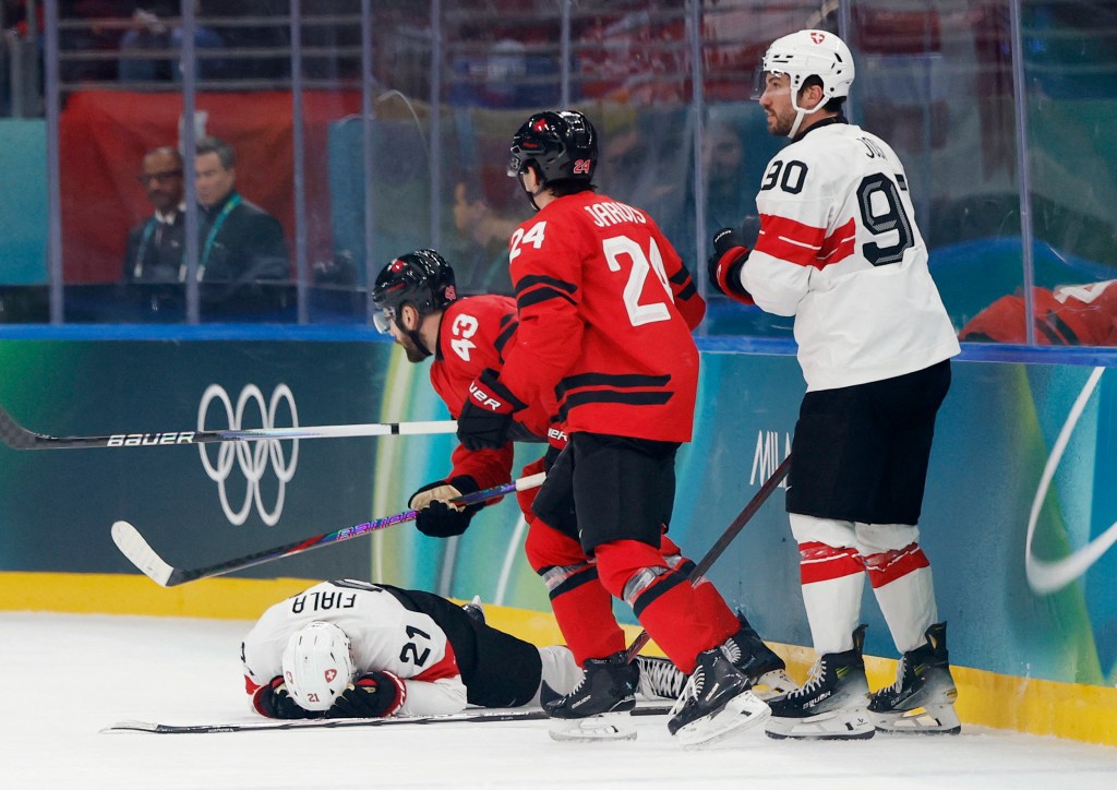Kevin Fiala suffers a leg injury during the Switzerland-Canada Olympic game on Feb. 13, 2026. 