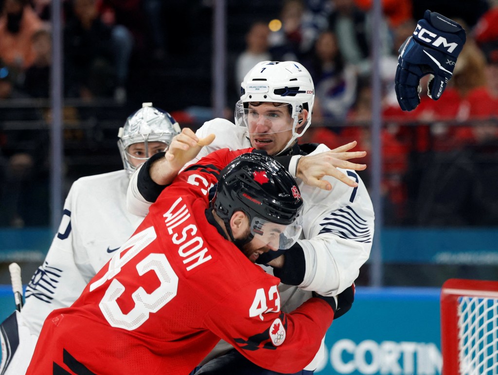 Canadian ice hockey player Tom Wilson clashing with French player Pierre Crinon.