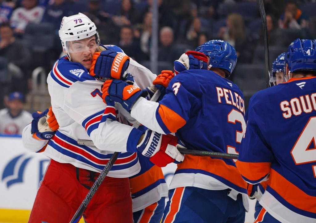 New York Rangers center Matt Rempe (73) and New York Islanders defenseman Adam Pelech (3) fight during the second period when the New York Islanders played the New York Rangers Wednesday, January 28, 2026 at UBS Arena in Elmont, NY.
