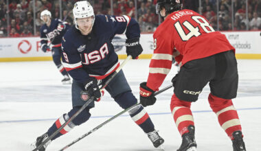 United States' Jack Eichel (9) takes a shot as Canada's Thomas Harley (48) defends du ...