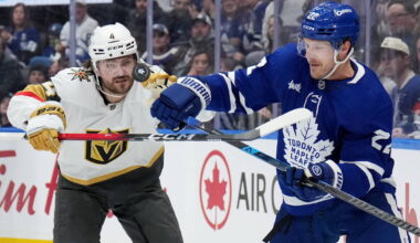 Vegas Golden Knights Rasmus Andersson (4) battles for the puck with Toronto Maple Leafs' J ...