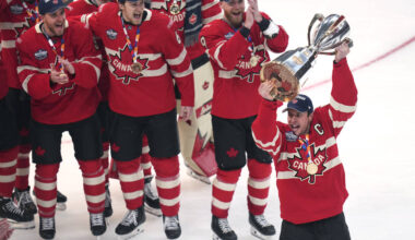 Canada captain Sidney Crosby, right, hoists the trophy after defeating the United States follow ...