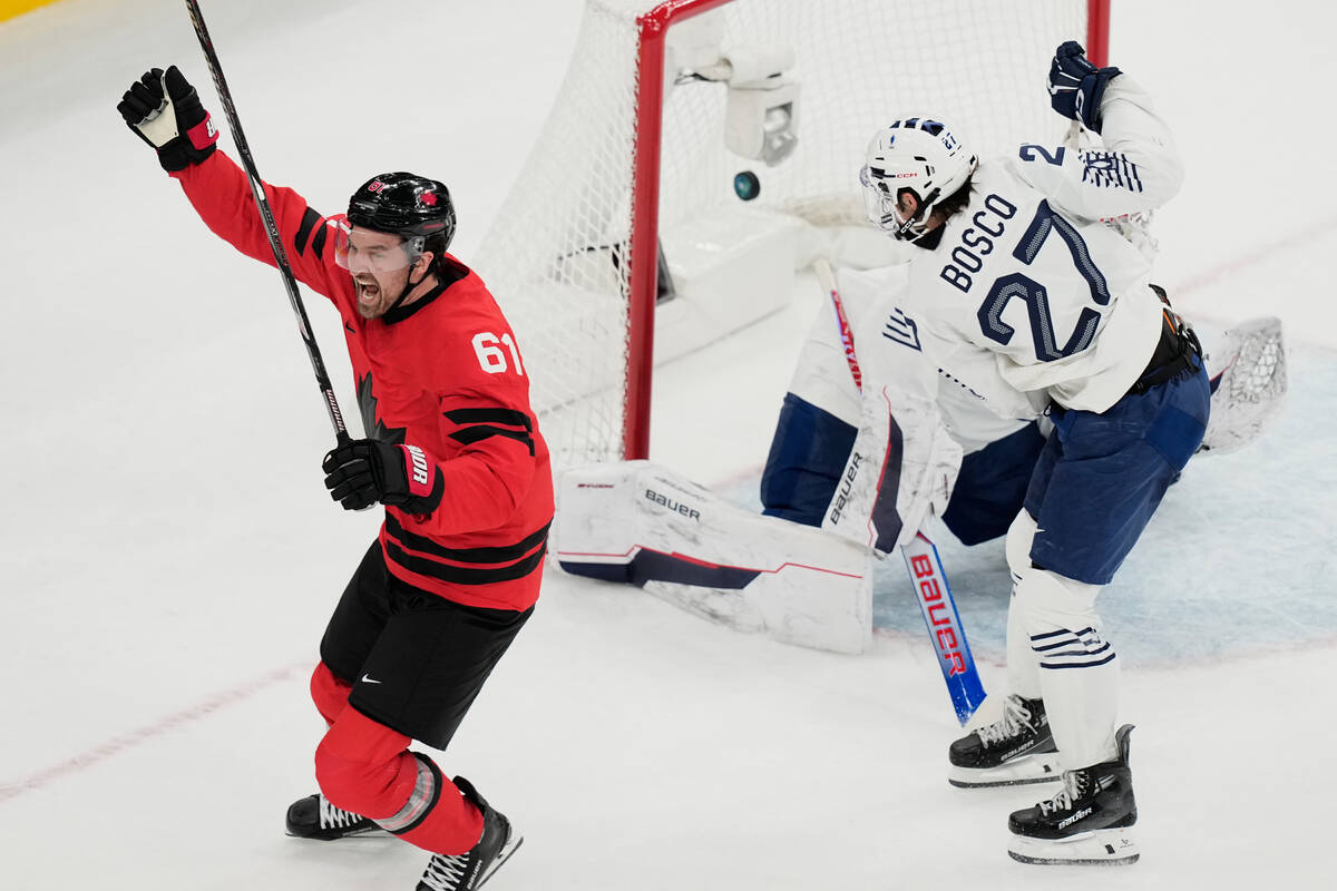 Canada's Mark Stone (61) celebrates after scoring a goal against France's goalkeeper ...