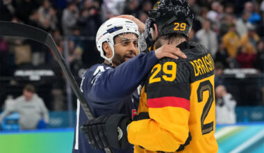 Germany's Leon Draisaitl (29) and France's Pierre-Edouard Bellemare talk after a men& ...