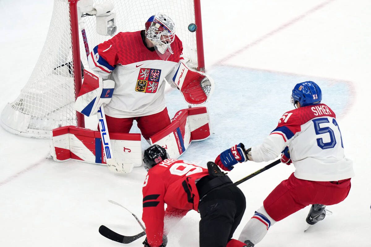 Canada's Mitch Marner (93) scores the winning goal past Czechia goalkeeper Lukas Dostal (1 ...