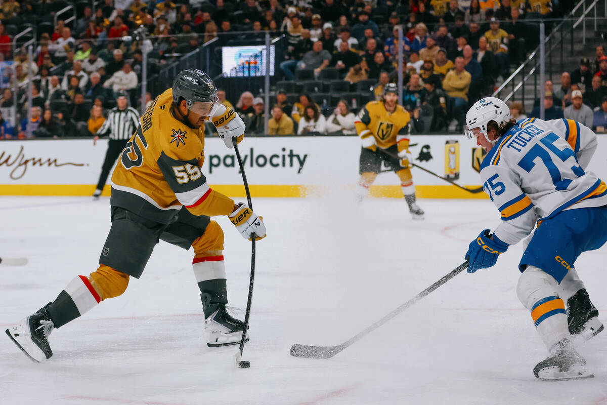 Golden Knights right wing Keegan Kolesar (55) takes a shot on goal against St. Louis Blues defe ...