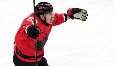 Canada's Brad Marchand celebrates after teammate Shea Theodore scored against Finland duri ...
