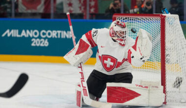 Switzerland's goalkeeper Akira Schmid eyes the puck during a preliminary round match of me ...