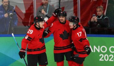 MILAN, ITALY - FEBRUARY 20: Sam Reinhart #13 of Team Canada celebrates with teammates Nathan MacKinnon #29 and Macklin Celebrini #17 of Team Canada after scoring a goal in the second period during the Men's Semifinals Playoff match between Canada and Finland on day fourteen of the Milano Cortina 2026 Winter Olympic games at Milano Santagiulia Ice Hockey Arena on February 20, 2026 in Milan, Italy. (Photo by Jamie Squire/Getty Images)